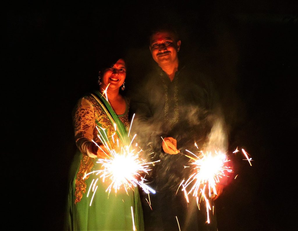 Divali in Trinidad - Lighting sparklers and fireworks