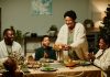 5 Unique Christmas Dinner Ideas - A family sitting down for Christmas dinner,